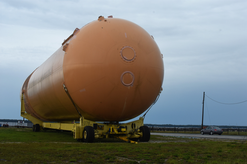 An engineering marvel next to an abandoned shuttle fuel tank.